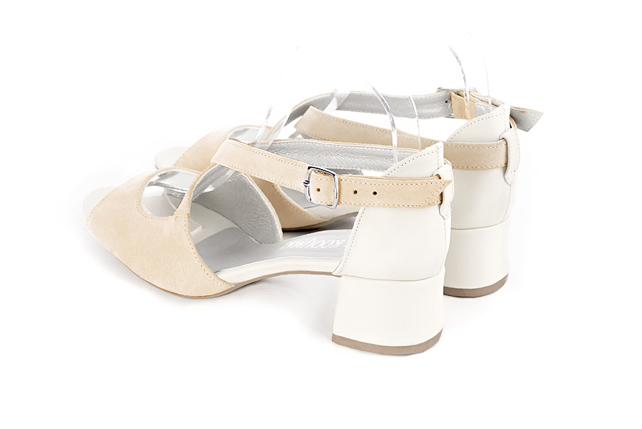 Women's egg shell beige and off white elegant sandals closed at the back with crossed straps. Round toe. Low flare heels - Rear view